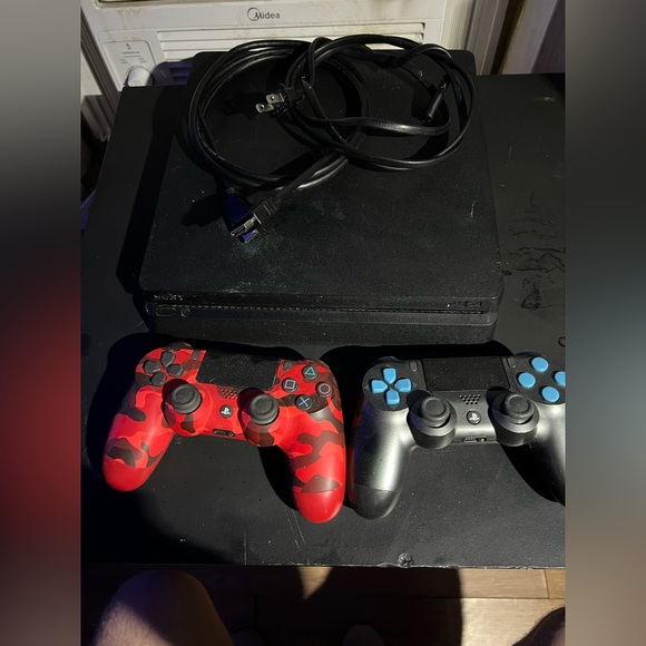 PS4 with controllers and games